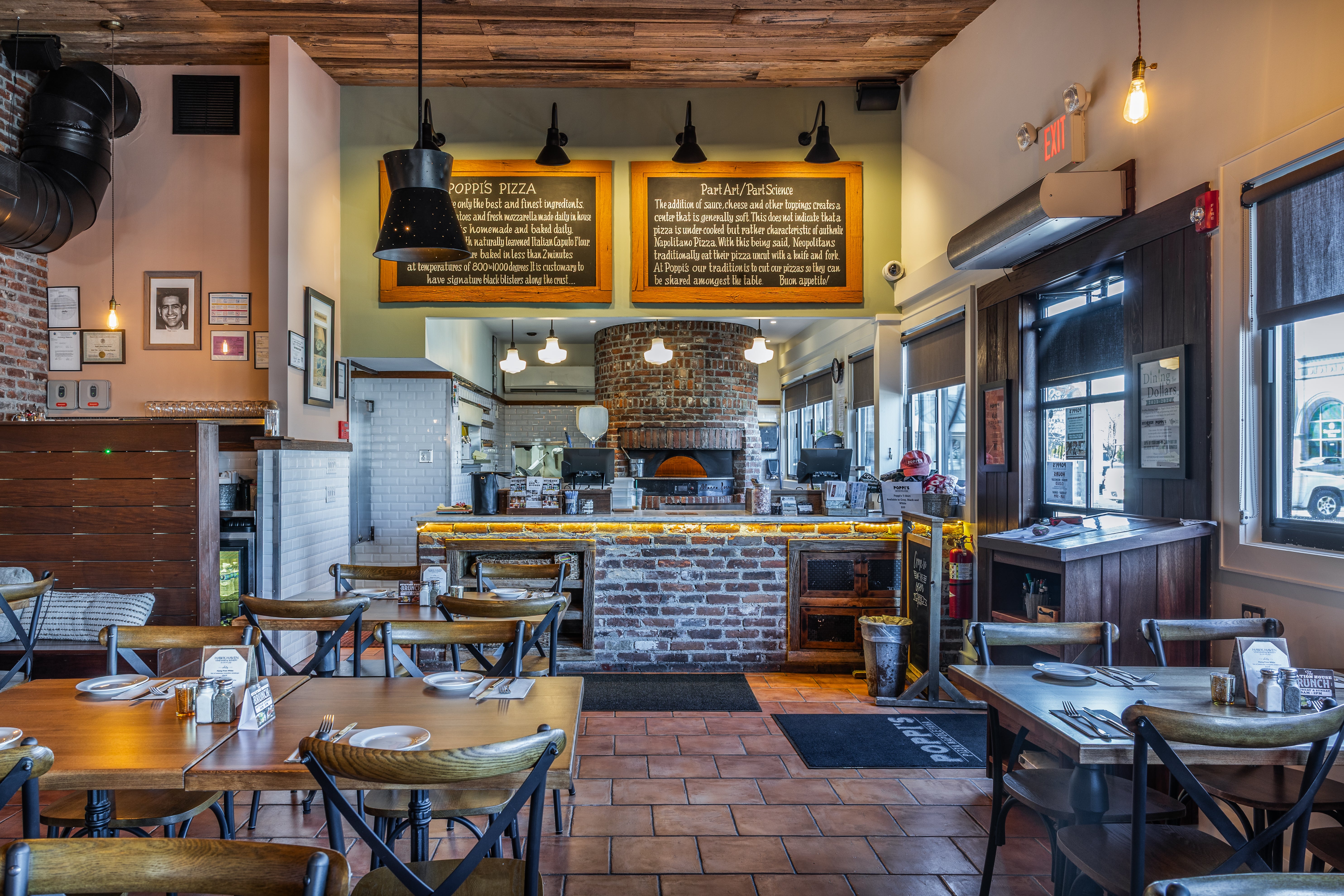 Poppi's dining room, with the wood-fired oven at the back